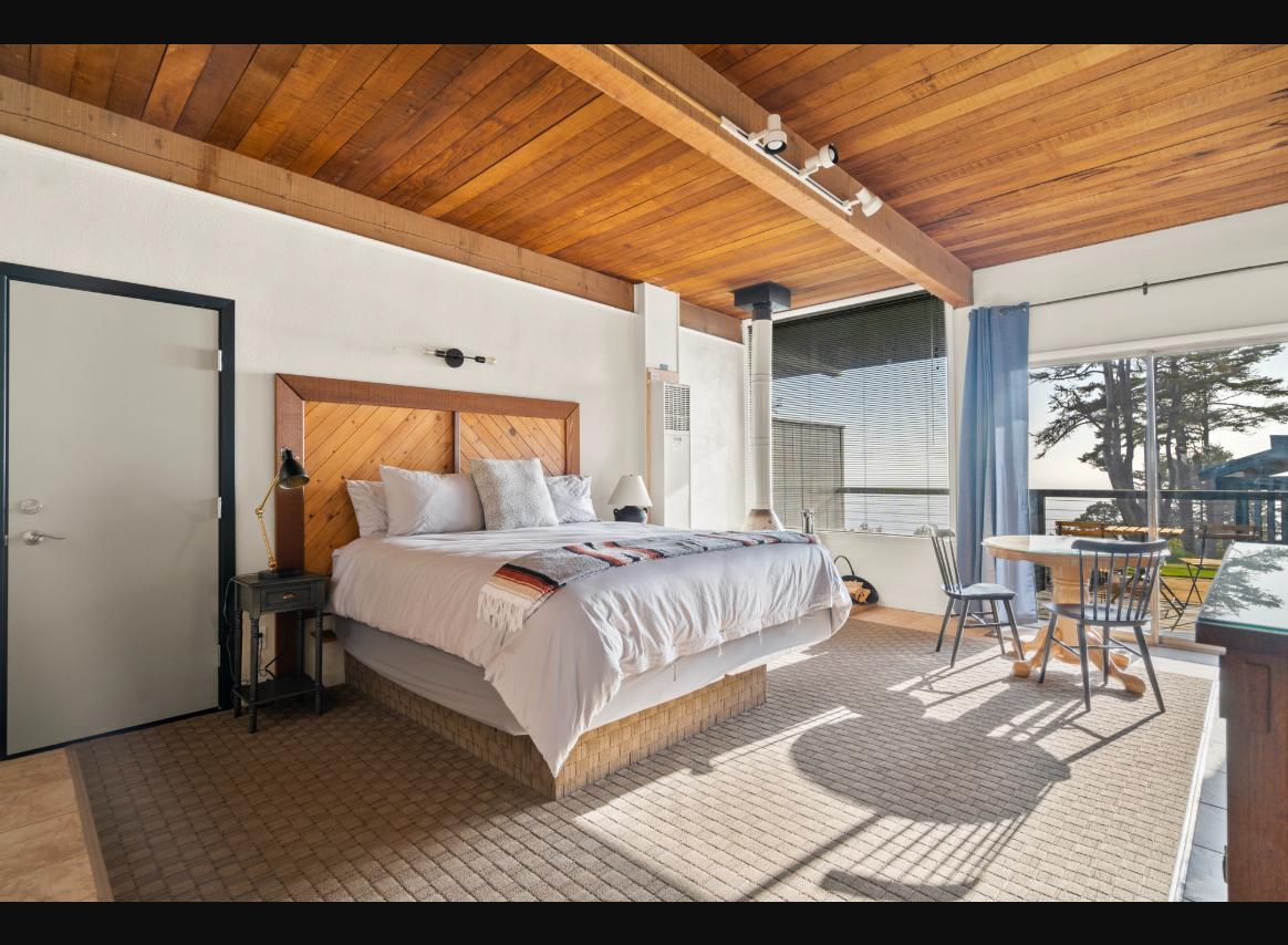Boutique guest room with king bed and ocean view
