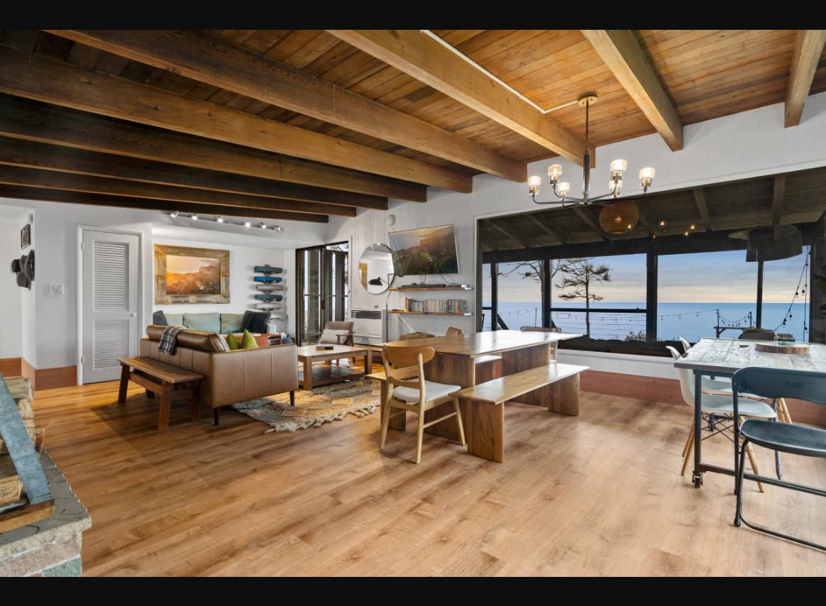 Indoor living space with wood beams and ocean view